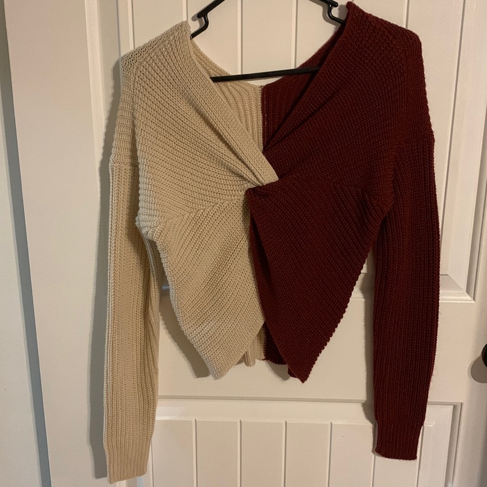 Half burgundy and half cream color sweater